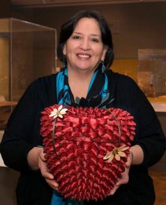 Kelly Church poses with her work