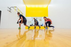 person leading a kettlebell class