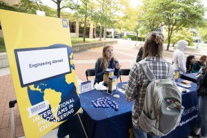 Student visits the International Program in Engineering table to speak with a Peer Adivsor