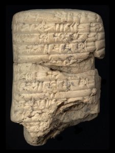 A stone tablet with cuneiform inscriptions.