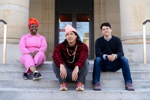 From left: Ozi Uduma, Assistant Curator of Global Contemporary Art at UMMA; Artist Cannupa Hanska Luger; and Paul Farber, Director and Co-Founder of Monument Lab surrounded by the architecture of Alumni Memorial Hall at the U-M Museum of Art. Photo by Ian John Solomon.
