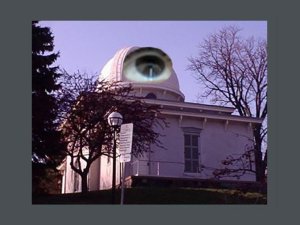 Large eyeball across the dome of the Detroit Observatory, looking toward the sky.