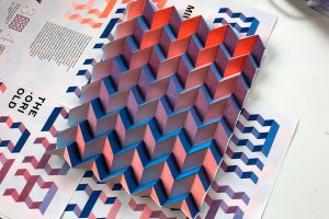 Blue and red paper folded into a 3-D accordion.