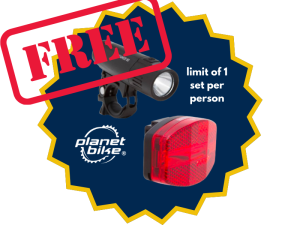 Free in red text, positioned on top of a maize & blue cut out with images of a front and rear bike lights. Text adjacent to the images states the Planet Bike logo and "limit of 1 set per person" Free in red text, positioned on top of a maize & blue cut out with images of a front and rear bike lights. Text adjacent to the images states the Planet Bike logo and "limit of 1 set per person"