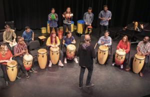 Professor Michael Gould leads a class in a percussion performance