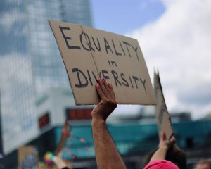 Photo of handwritten sign reading "Equality in Diversity"