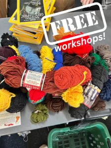 Pile of yarn with white text stating "free workshops"