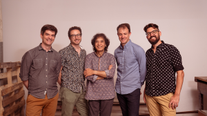The four members of Third Coast pictured with tabla virtuoso Zakir Hussain (center).
