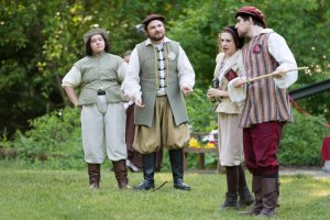 Four people act out a scene for a performance of Shakespeare in the Arb