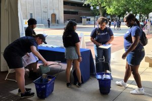 Library staff and students setting up for Summerfest 2023.