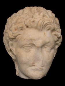 Marble sculpture of a satyr head.