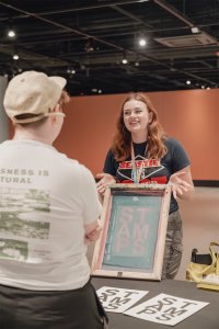 Students participate in a Stamps Gallery screen printing workshop.