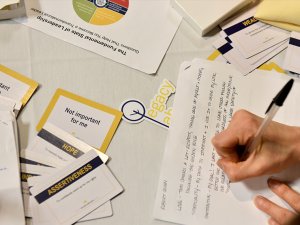 Legacy Lab sticker and student writing notes