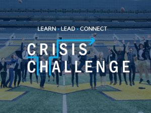Students celebrating on the Big House field for the Crisis Challenge