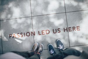 words on the ground "passion led us here"