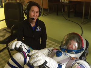 Dr. Natacha Chough assisting astronaut Dr. Natacha Chough assisting astronaut