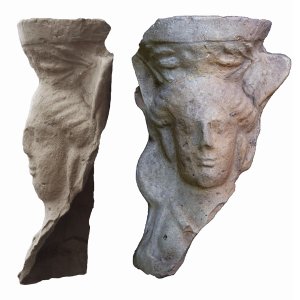 Side and front views of a face carved in stone.