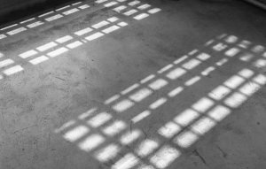 Light coming from the windows in an old building. Light coming from the windows in an old building.