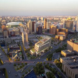 Aerial shot of the Detroit skyline, with a rendering of the future UMCI in the center