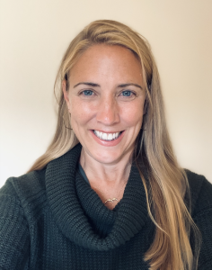 A photograph of Jane Willenbring wearing a dark blue-green sweater