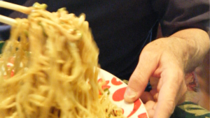Image of Larry Sklar eating noodles Image of Larry Sklar eating noodles