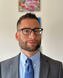 a headshot of Jake Grumbach