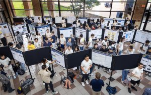 Students presenting to people attending the showcase in the Duderstadt Center Students presenting to people attending the showcase in the Duderstadt Center