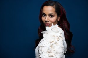 Rhiannon Giddens in white blouse with puffy sleeves