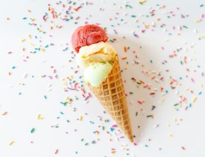 Ice cream cone surrounded by confetti
