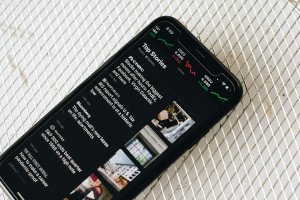 A smartphone displaying news headlines.