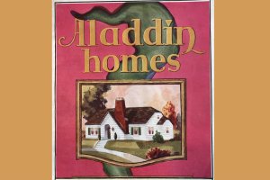 Partial cover of an Aladdin homes catalog, The Aladdin Company, 1934, showing a white house with green shutters and a red brick chimney.