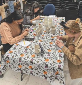 U-M students and staff doing crafts at last year's Spooky Swap Shop