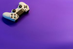 white controller with purple background