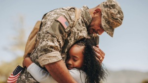 Soldier hugging a child