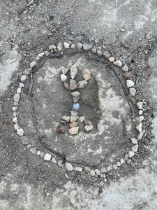 archaeological pit with stones