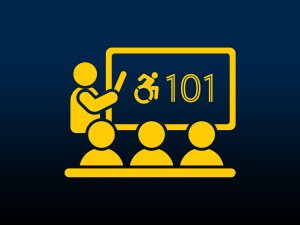 A person at a board displaying a person in a wheelchair and 101, three people looking at the board