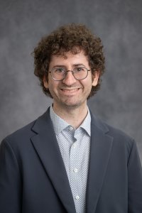 Professional headshot of Zach Berge-Becker