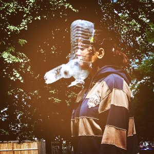 Deepa Buyoliya wears a DIY breathing apparatus constructed from plastic water bottles