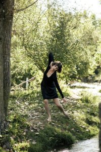 Kaitlyn Wilson dancing in nature