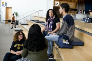 Opportunity Hub staff talking with students.