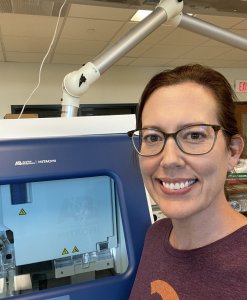Charlyn Partridge shown with lab equipment