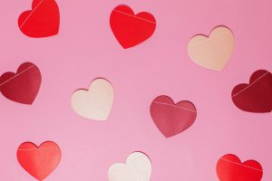 Paper Valentine's Day Hearts on a Pink Background