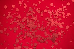Hearts on a red background