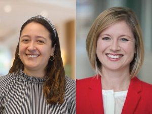 Two women smile at the camera