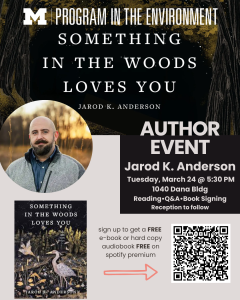 Photo of visiting author Jarod K. Anderson, with a background of his memoir's book cover for "Something in the Woods Loves You"