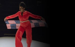 Holly Bass in a red jumpsuit