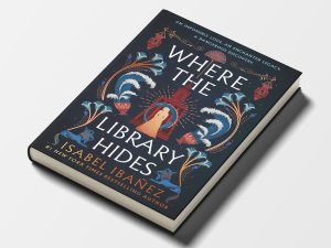 The cover of “Where the Library Hides” by Isabel Ibañez, with an illustration of a woman standing in front of a building surrounded by lamps, water-filled goblets, and three-headed dogs.