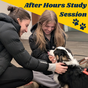 After Hours Study Session at the Clements Library. Image of two students with a therapy dog.