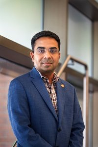 Headshot of professional with blue blazer