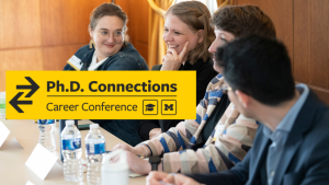 panelists talking and laughing with phd connections logo